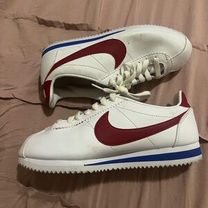 red, white, and blue nike cortez